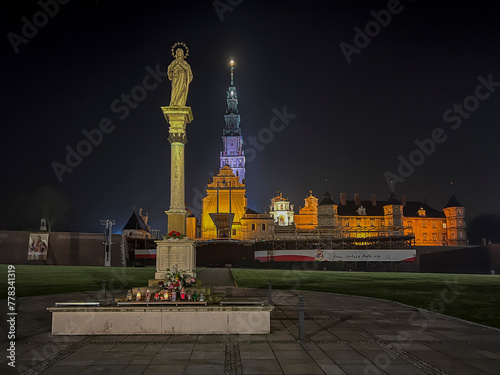 Jasna Gora Monastery and the column with the Blessed Virgin Mary in Czestochowa at night. The inscription on the banner in Polish "Jesus meets his mother"