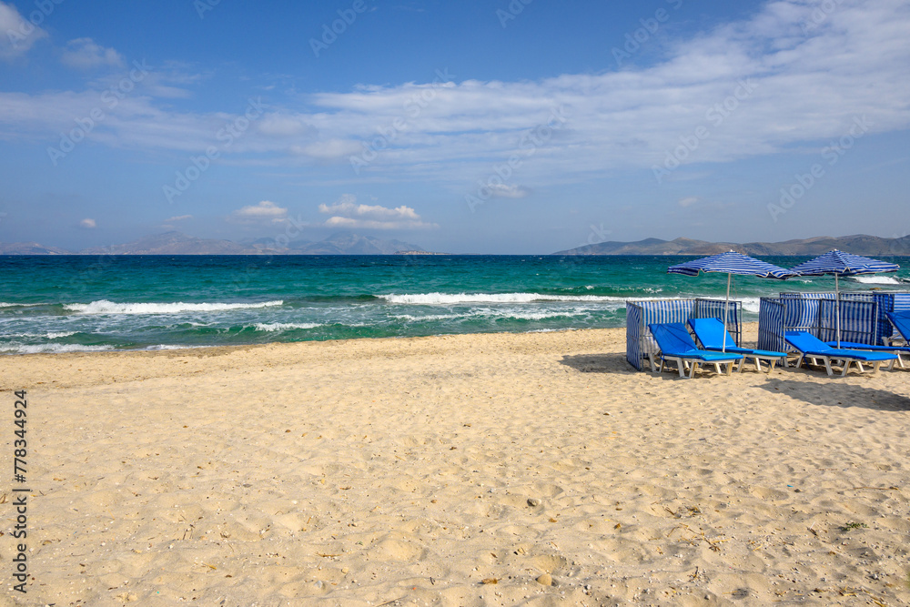 Beautiful Marmari beach with golden sand and emerald waters. Kos island, Greece Beautiful Marmari beach with golden sand and emerald waters. Kos island, Greece