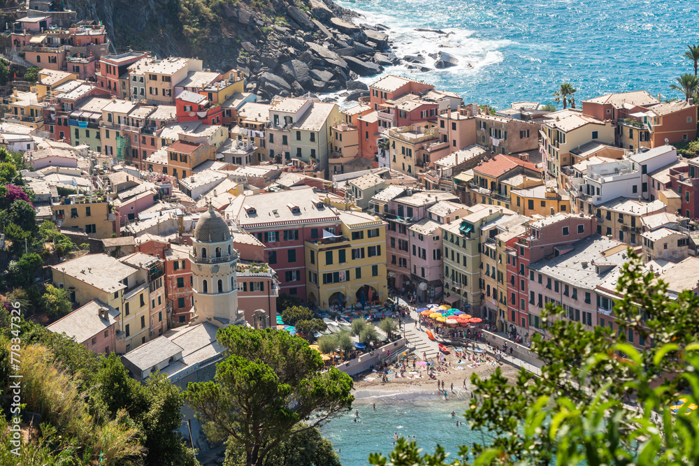 high angle view to Vernazza town,  one of Cinque Terre, and its bay harbor, on a sunny summer day