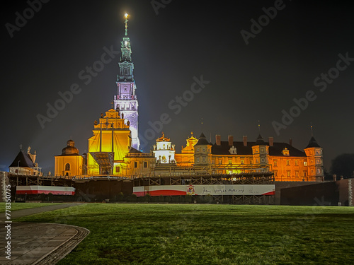 Jasna Gora Monastery in Czestochowa at night. The inscription on the banner in Polish "Jesus meets his mother"