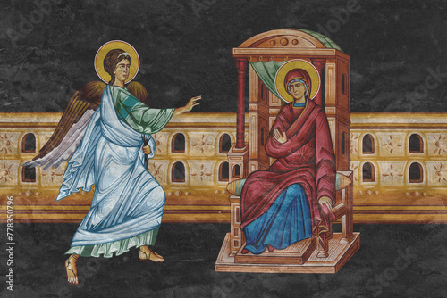 Christian traditional image of Annunciation to the Blessed Virgin Mary. Religious illustration on black stone wall background in Byzantine style