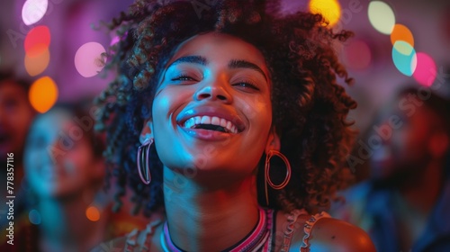 Smiling Woman With Curly Hair in Front of Group