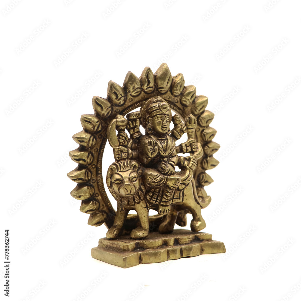 statue of goddess durga devi of hindu religion holding multiple weapons in her many arms, sitting on her lion, handcrafted with details in golden brass isolated in a white background statue of goddess durga devi of hindu religion holding multiple weapons in her many arms, sitting on her lion, handcrafted with details in golden brass isolated in a white background