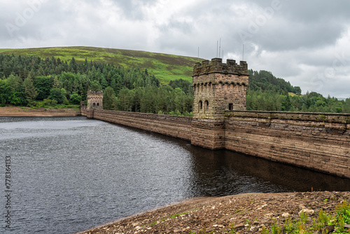 Howden reservoir in the Peak District in Derbyshire, England. These towers and reservoir were used by the famous Dambusters squadron.  photo