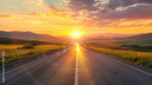 Open road stretching into a sunrise conveying the journey of life and endless possibilities