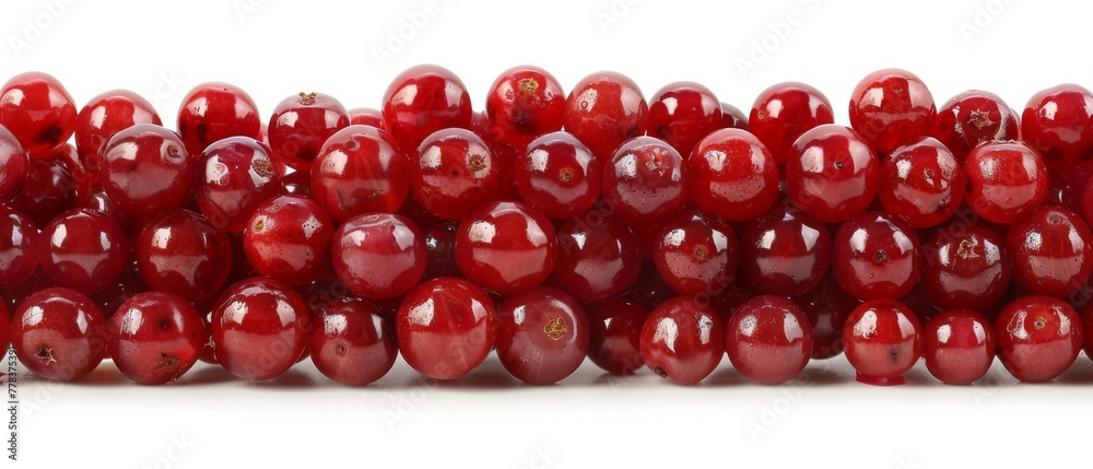 Red pomegranates arranged on white surface against white backdrop Red pomegranates arranged on white surface against white backdrop