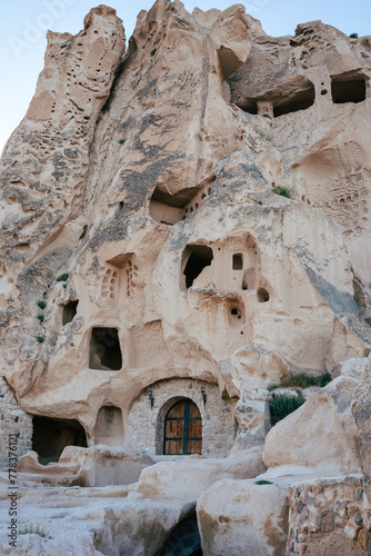 Time-worn cave houses carved into the rock face of Cappadocia, standing as a testament to ancient ingenuity © Mirador