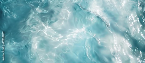 Top view, blue water is white with ripples on the surface. Defocus white transparent blurred calm water surface texture  photo