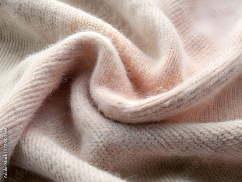 Soft cashmere, close-up, knitted texture, pastel shades.