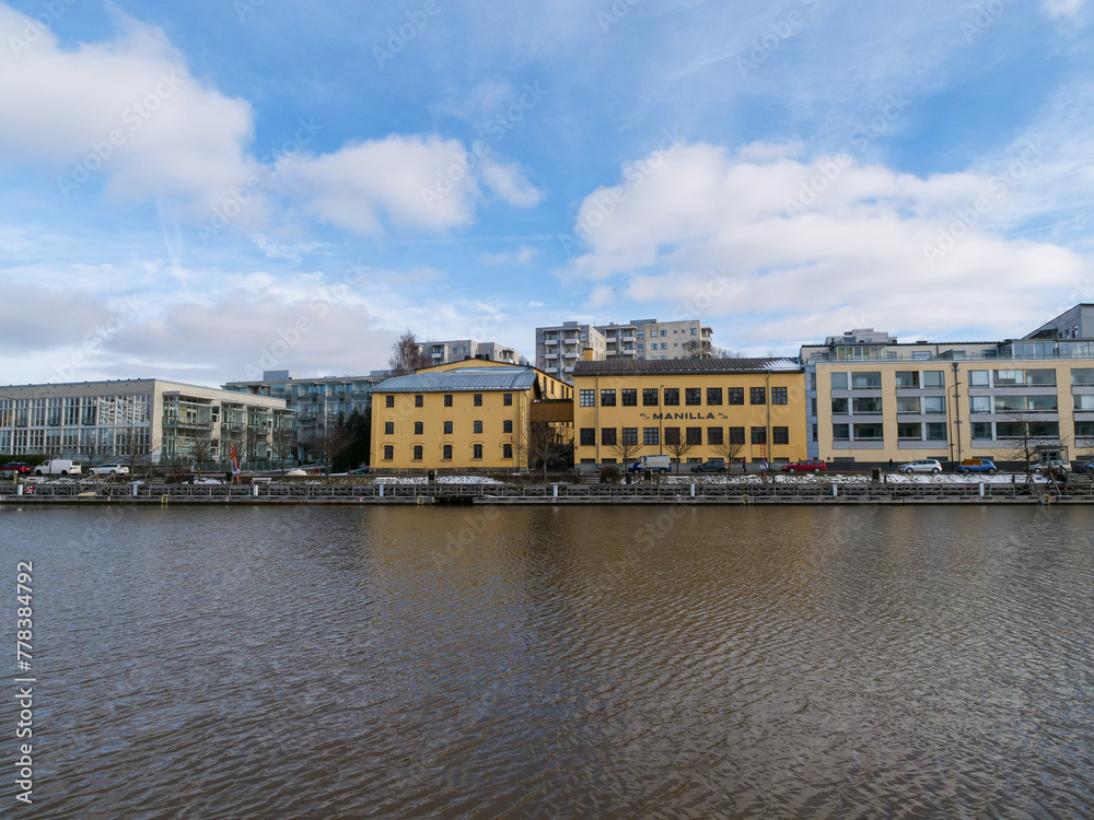 Obraz premium A beautiful view on the shore of Aura river on a sunny spring day. Turku, Finland