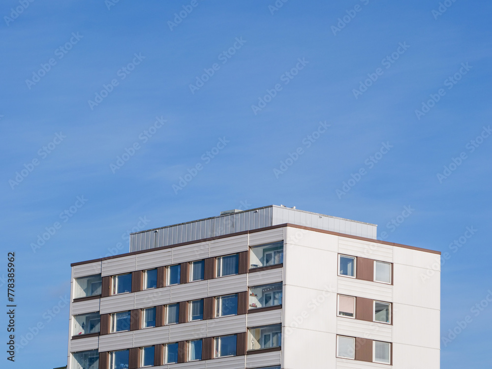 Apartment building against the blue sky