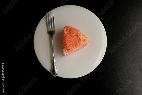 Cheese Cake with fork on a plate