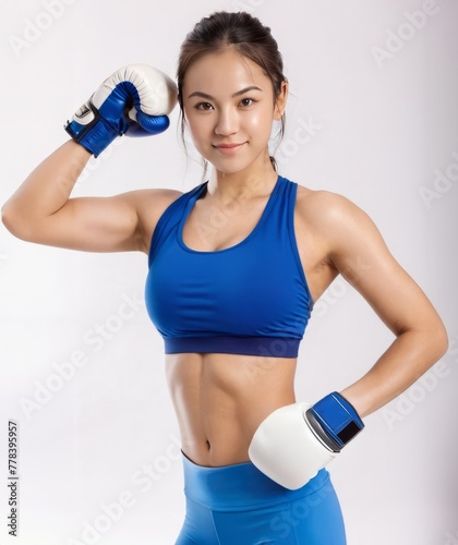 Young and Beautiful Asian Girl in Blue Bra and Boxing Gloves