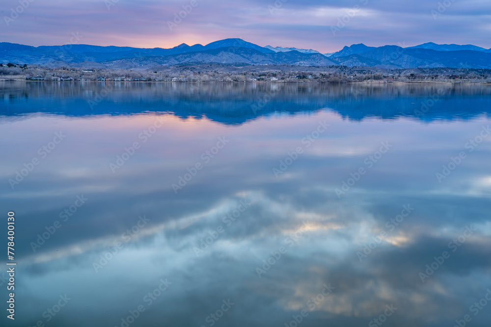 dusk over calm lake in Colorado foothills of Rocky Mountains, Boedecker Reservoir in early spring