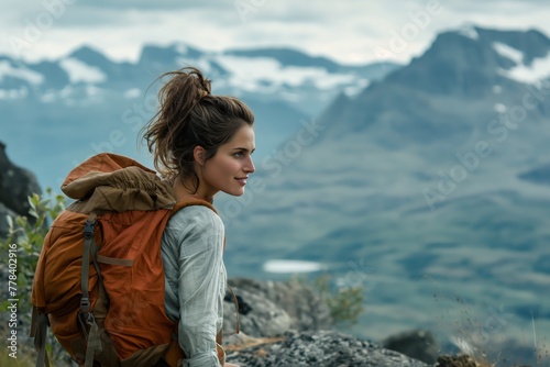 Female Hiker Looking Out Over Mountain Peaks