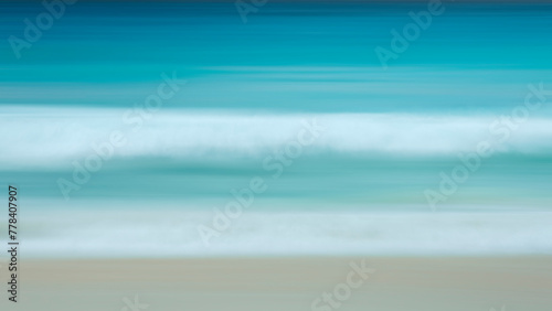 Fototapeta Naklejka Na Ścianę i Meble -  Abstract background of blue sea wave Motion blur sea water and white sand.