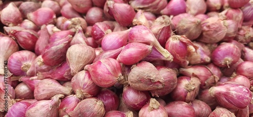 Pile of fresh red onions background