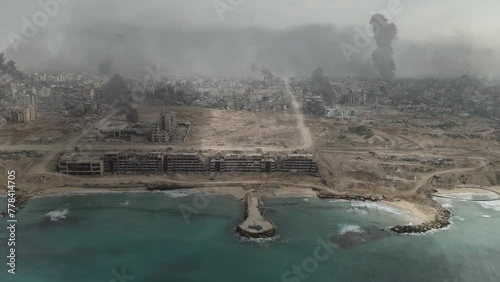 Gaza city destroyed in the war withcoastline, aerial wide shot,
Drone view over North Gaza buildings bombarded,Gaza-March,20,2024
