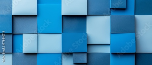  A close-up of a wall with blue and white square and rectangle variations in size and shape