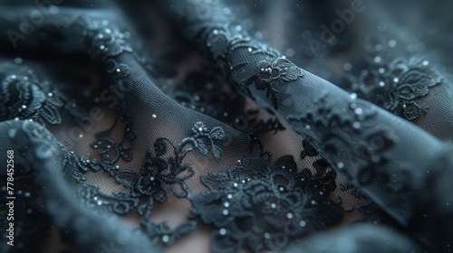 a close up of a black dress with beads and laces on the bottom of the dress and the bottom of the dress.