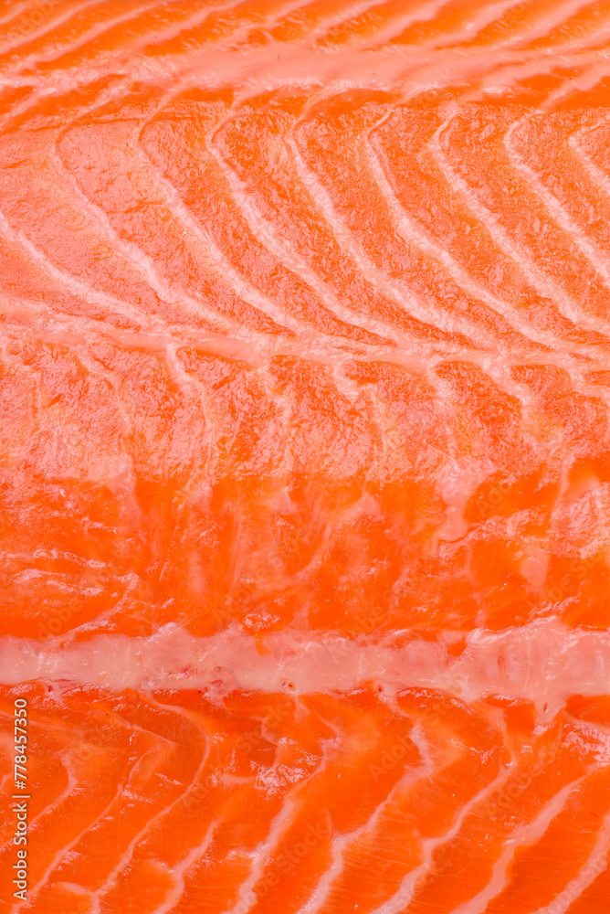 Fresh raw salmon steak with spices and herbs prepared for grilled baking Fresh raw salmon steak with spices and herbs prepared for grilled baking
