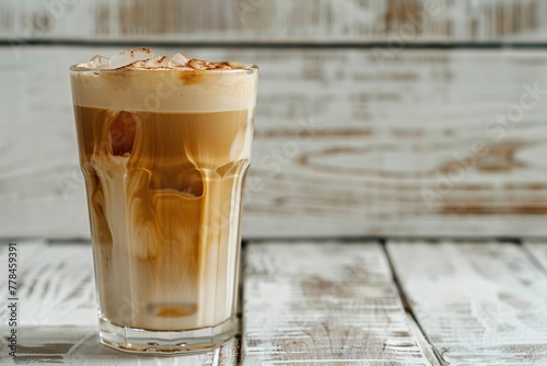 Glass of iced coffee on wooden table