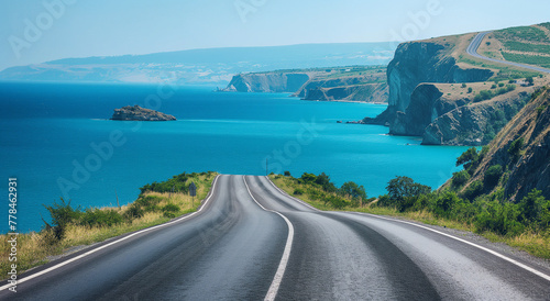 Scenic coastal road with sharp curves along the sea cliff, perfect for travel blogs and destination websites