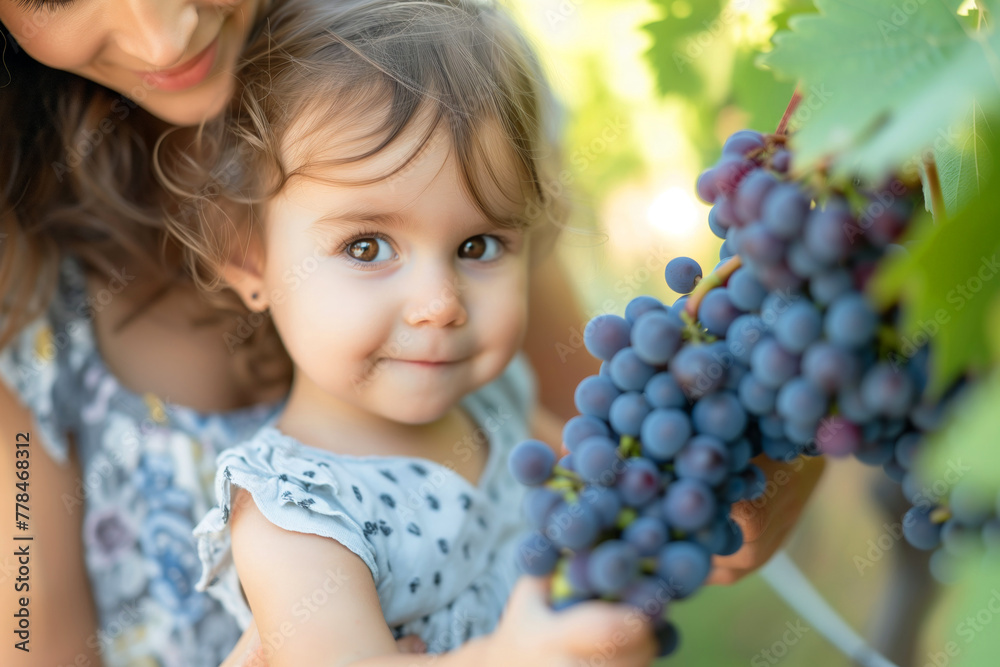 Portrait of cute little girl and her mother in vineyard Portrait of cute little girl and her mother in vineyard