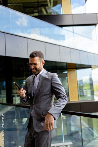 Confident Businessman Smili...