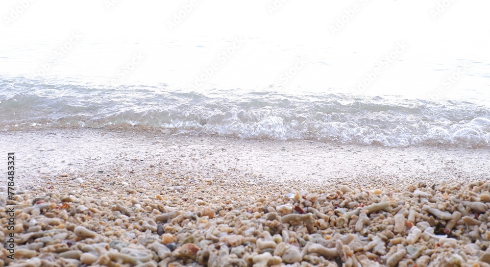 beach sand and sea wave on white background, soft focus. beach sand and sea wave on white background, soft focus.