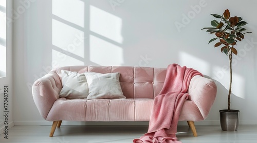 A Modern Living Room With a White Couch and Abundant Plants