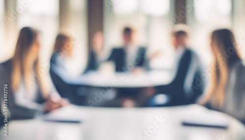 Blurred business team meeting in modern office conference room