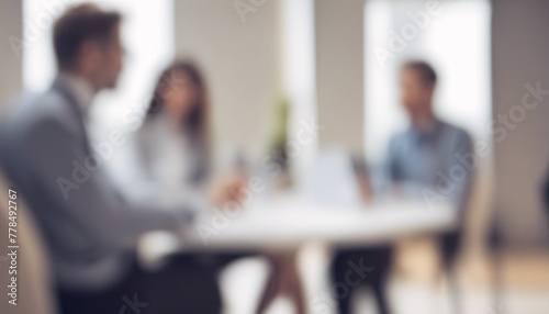 Blurred business team discussion in modern office workspace