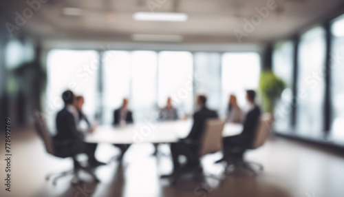 Blurred corporate meeting in modern office boardroom interior