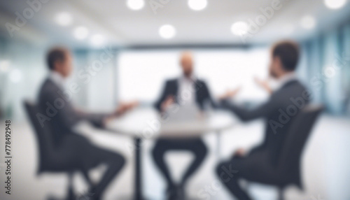 Blurred business discussion in modern office meeting room