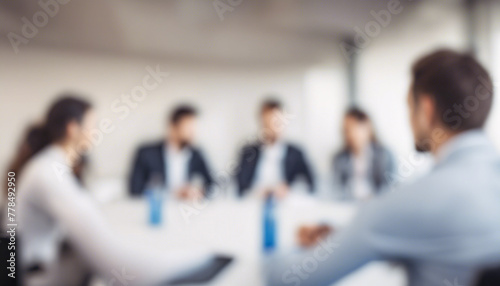 Blurred business team discussion in modern office meeting room