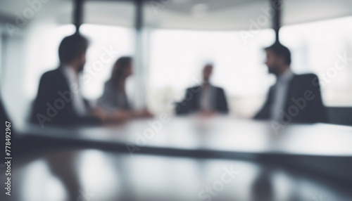 Blurred corporate business meeting in modern office conference room