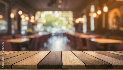 Whispers of Tradition: Empty Wooden Table Amidst Blurred Restaurant Ambiance