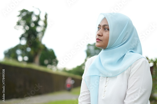 Portrait of an Asian woman wearing a hijab in the park