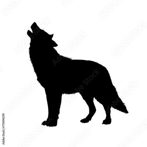 The silhouette of a wolf howling at the moon
