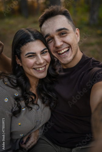 Man and woman young adult couple in nature self portrait selfie ugc