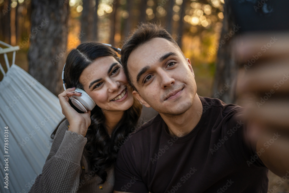 Man and woman young adult couple in nature self portrait selfie Man and woman young adult couple in nature self portrait selfie