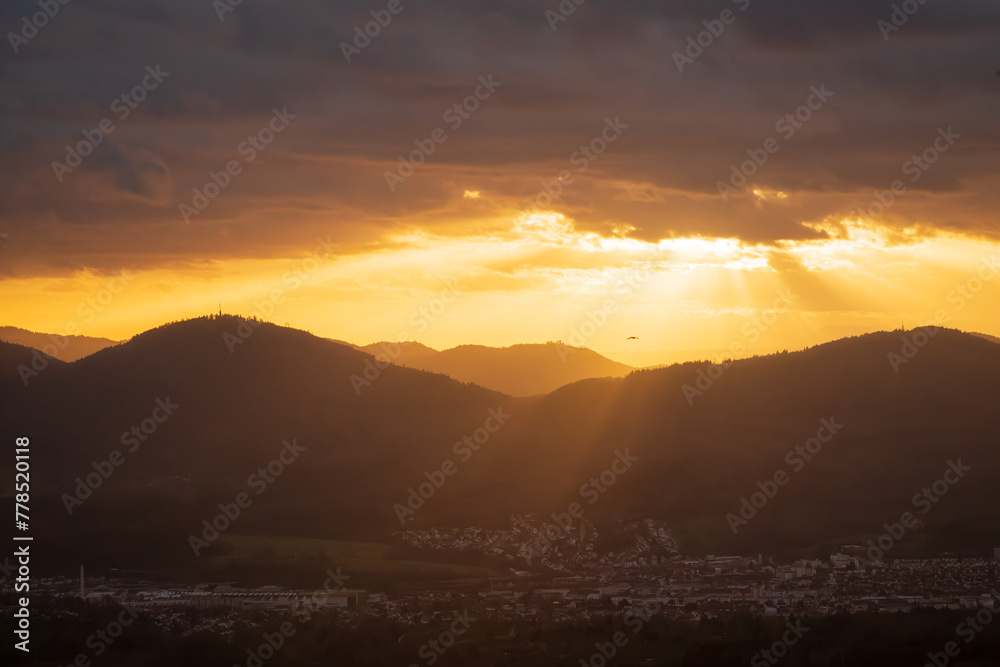 custom made wallpaper toronto digitalThe golden rays of the setting sun shine over a mountain ridge in the Murgtal valley in the German northern Black Forest