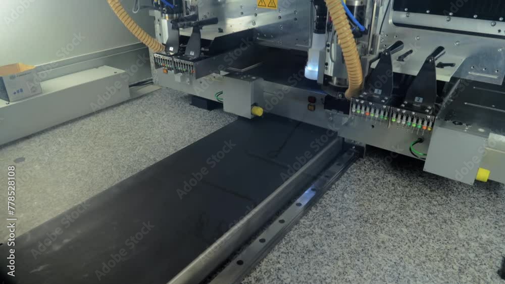 Large Automated PCB Milling Machine Has Two Working Heads And Casings With Various Types Of Drills Labeled With Colors. Electronics Manufacturing Plant. Circuit Board Production.Conveyor line.Close up Large Automated PCB Milling Machine Has Two Working Heads And Casings With Various Types Of Drills Labeled With Colors. Electronics Manufacturing Plant. Circuit Board Production.Conveyor line.Close up