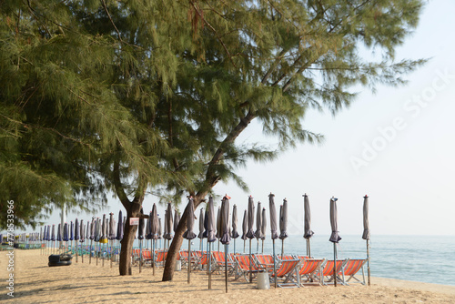 Beach deck chairs and umbrella in the morning at Cha-am Beach. Located at Phetchaburi Province in Thailand.