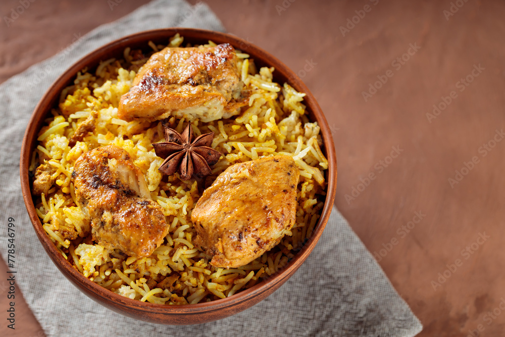 Delicious Indian Dish Chicken Biryani with Basmati Rice in Bowl, Top View, Copy Space Delicious Indian Dish Chicken Biryani with Basmati Rice in Bowl, Top View, Copy Space