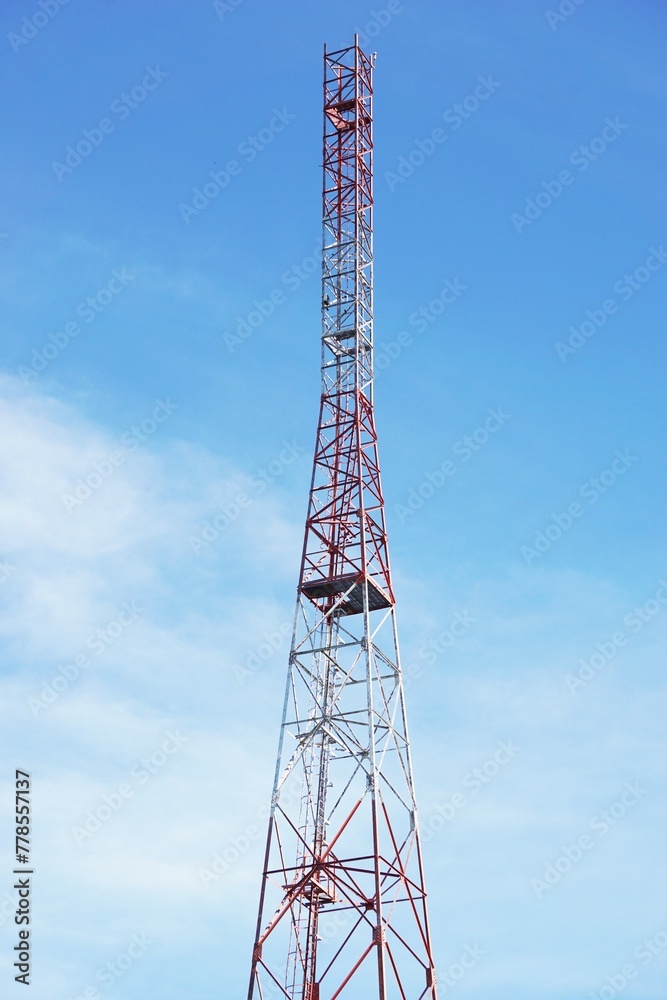 White and red tower with blue sky background in nature White and red tower with blue sky background in nature