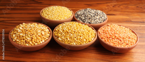 A bowl of mixed lentils that are widely used in India. Lentils are Red lentil, Mung bean, Black gram, Pigeon pea and split Chickpea.