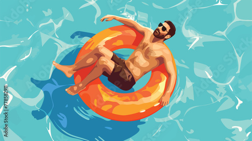 Handsome man floating on an inflatable circle in th