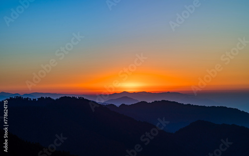 landscape view of sunrise over the mountains in Nepal © gorkhe1980